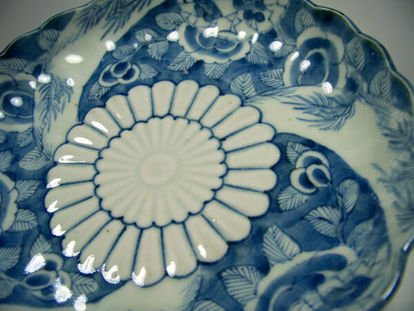Japanese mon plate blue and white detail