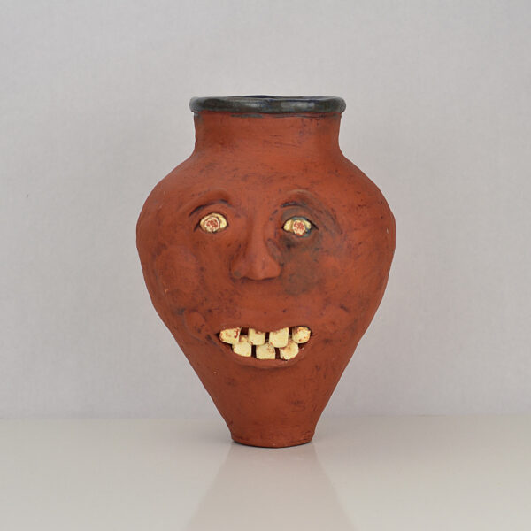 Face jug or vase made of terracotta