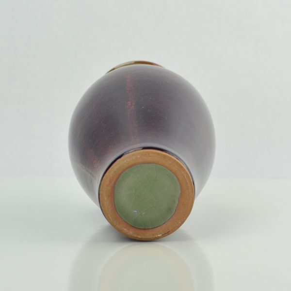 Ox blood celadon Chinese or possibly Southeast Asia vase. A baluster form vase -base
